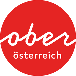 Logo Oberösterreich Tourismus: Roter Kreis mit weißem Oberösterreich-Schriftzug